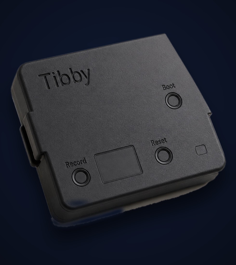 The Tibby wearable device — a compact clip-on unit with Record, Boot, and Reset buttons and a USB-C port
